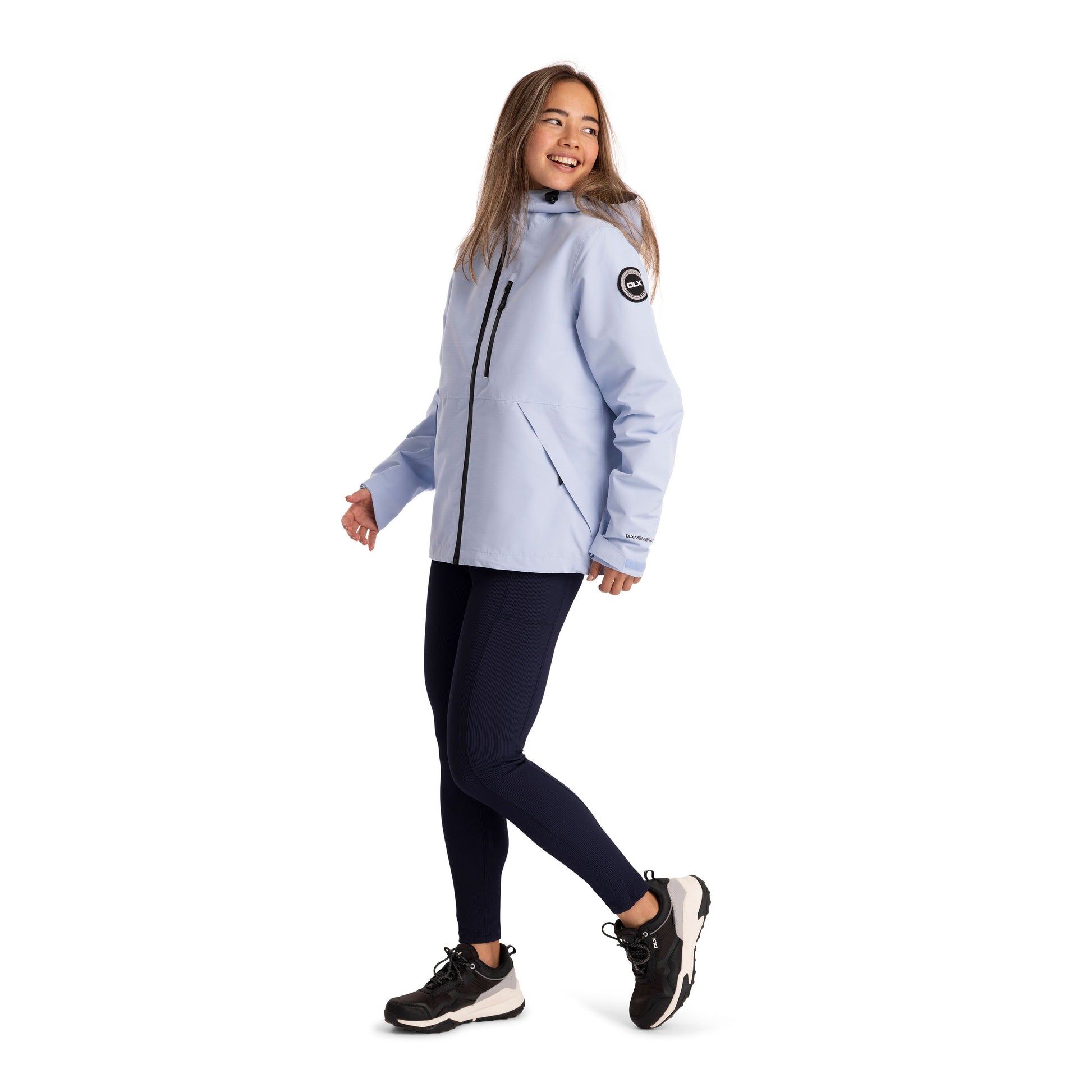 Side View of a Woman wearing a light blue jacket with a logo on a white background