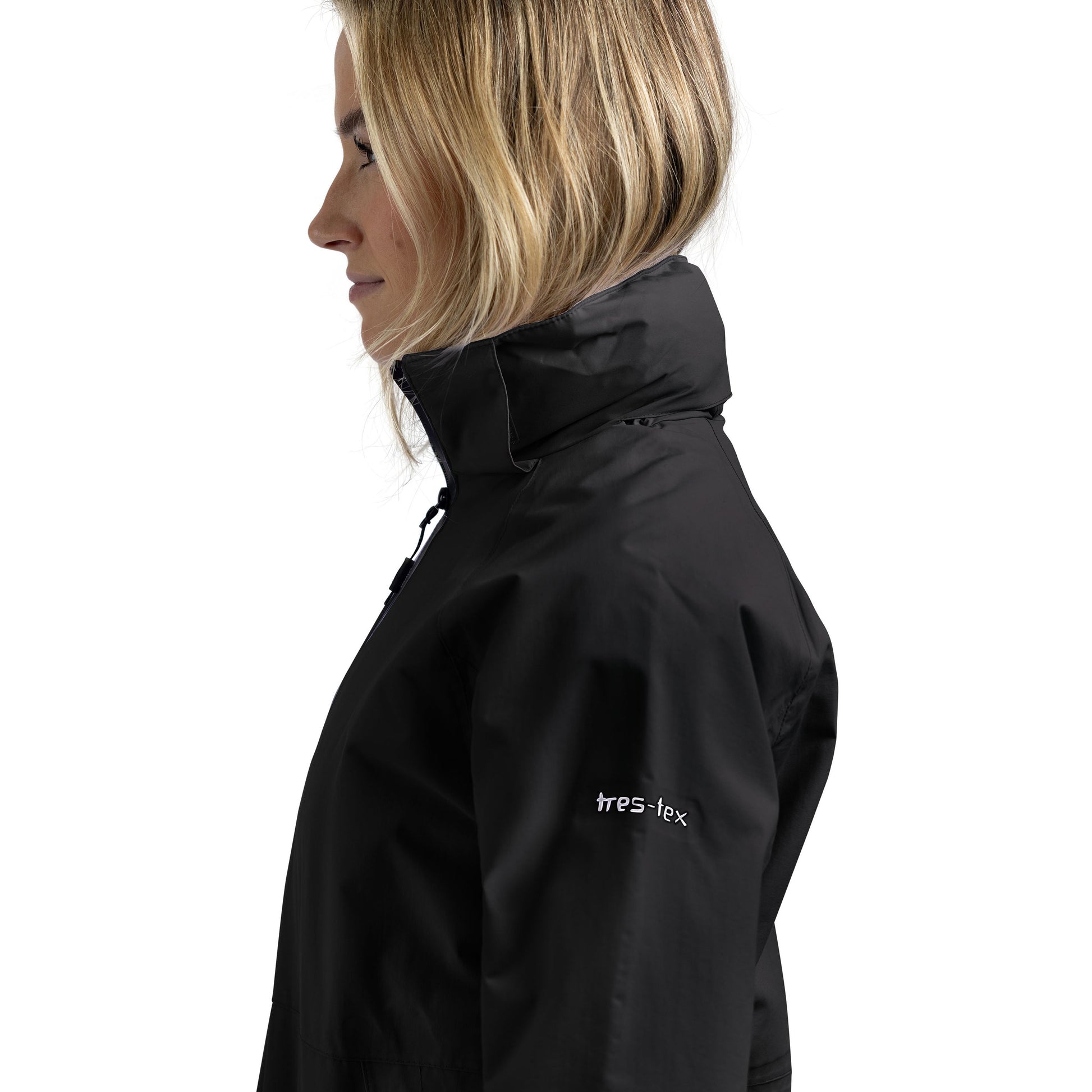 Woman wearing a black jacket with Trespass branding on a white background