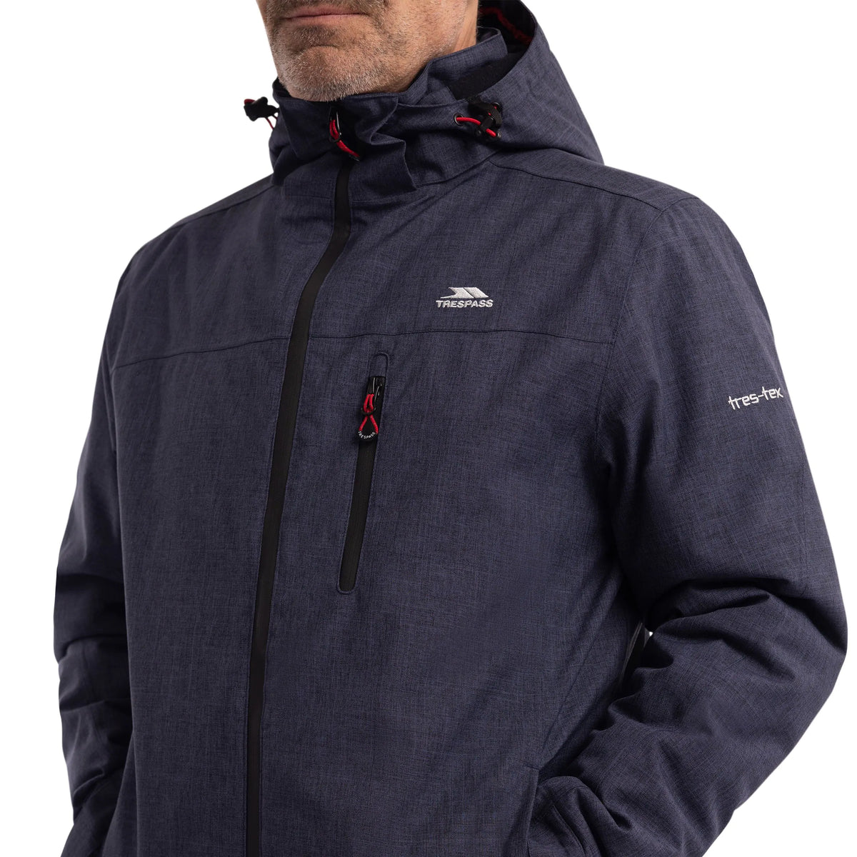 Close-up of the chest zip and pockets on the Fyfinn padded jacket in Navy Marl