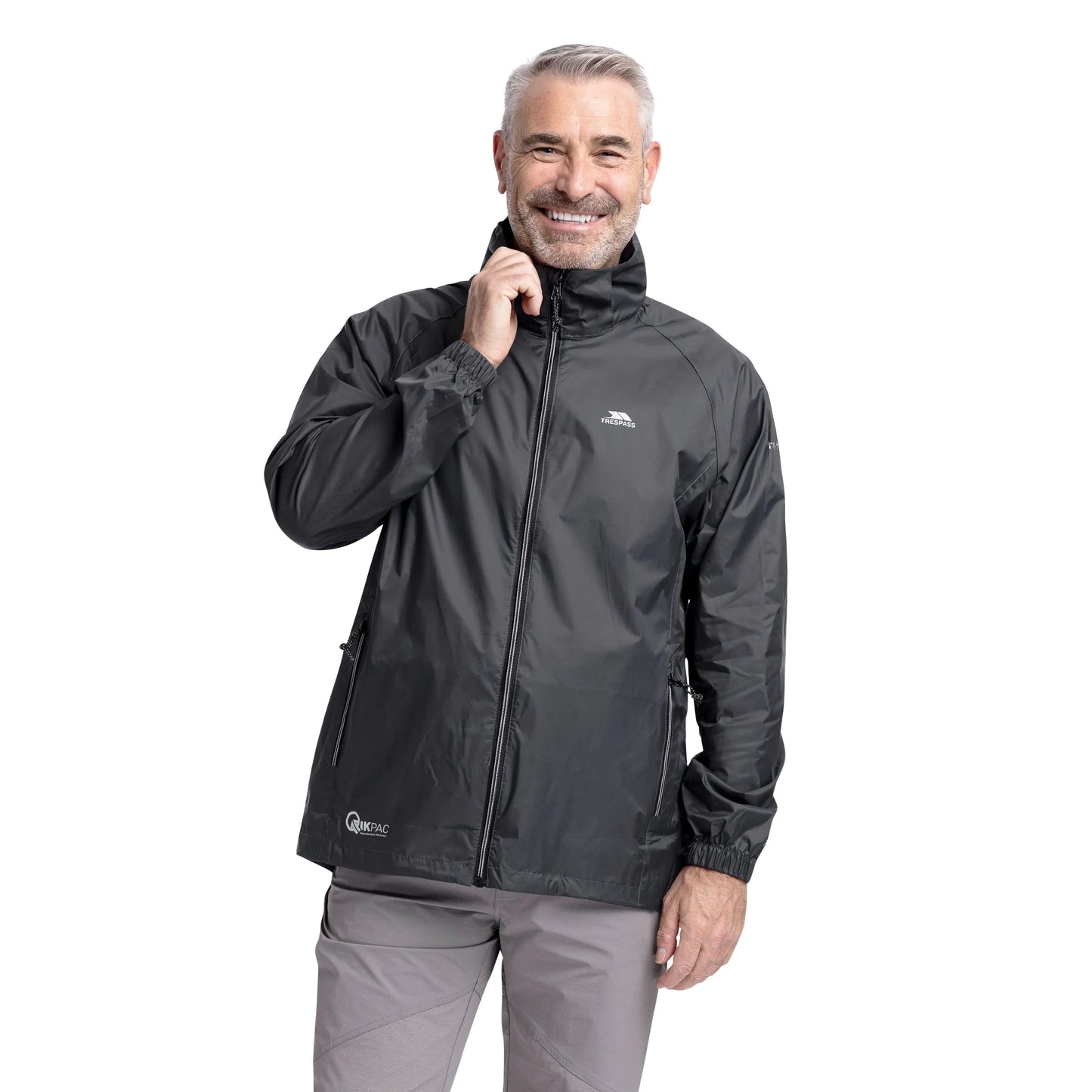 Man wearing a Flint Grey Trespass Qikpac Jacket with a visible brand logo on a white background