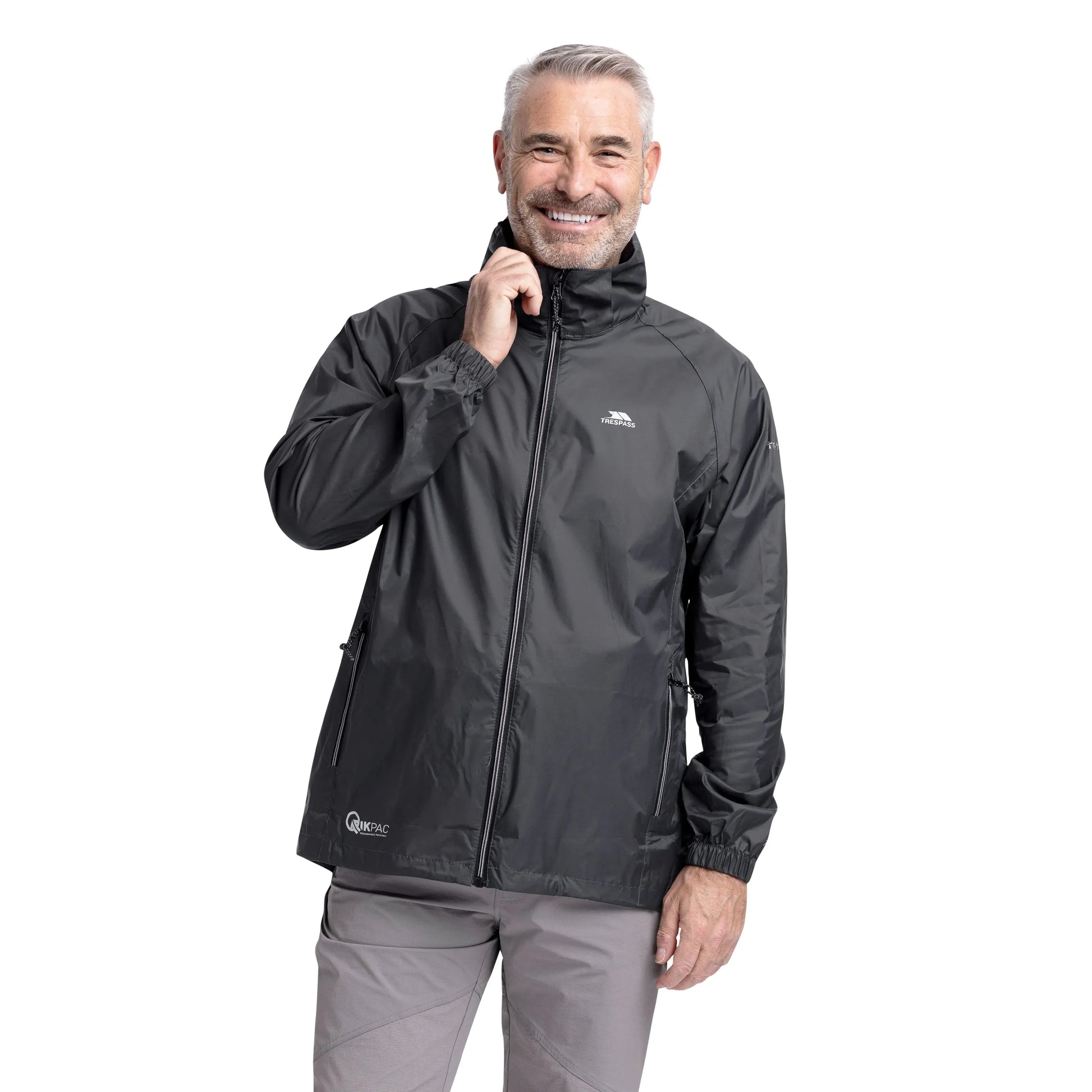 Man wearing a Flint Grey Trespass Qikpac Jacket with a visible brand logo on a white background