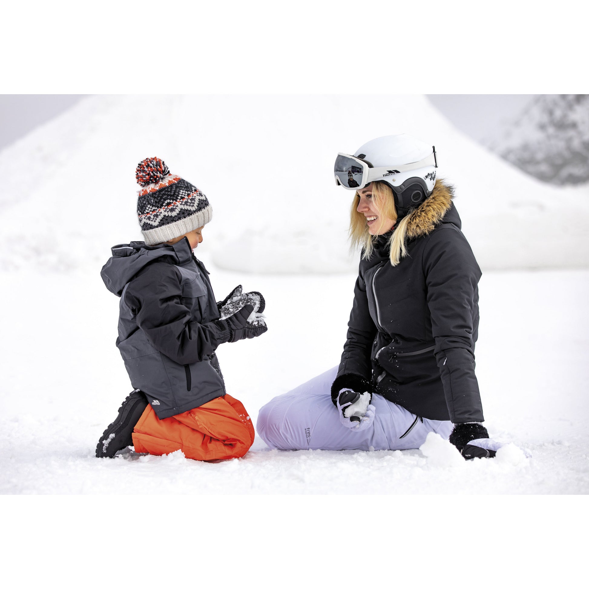 woman and child in ski gear from trespass